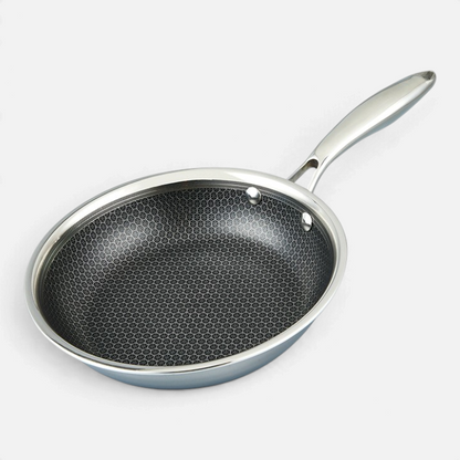 Ostrera 28 cm stainless steel hybrid frying pan with a durable honeycomb non-stick surface and ergonomic handle