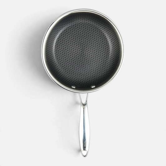 Ostrera 28 cm stainless steel hybrid frying pan with a non-stick honeycomb surface and ergonomic metal handle